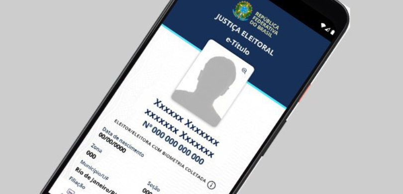 Mais que um documento: quais as funções e vantagens do e-Título Imagem na qual é possível ver a tela de um celular, com o aplicativo do e-Título aberto, nele é ...
